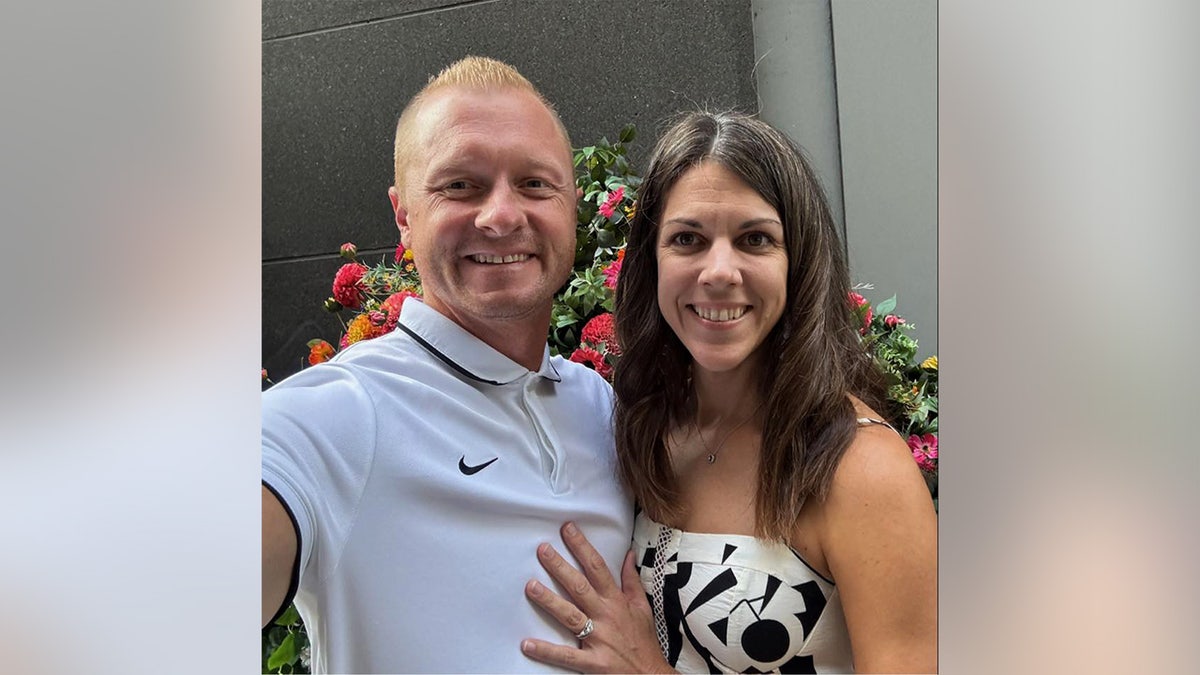 Jason and Laura Hughes smiling successful  an undated selfie