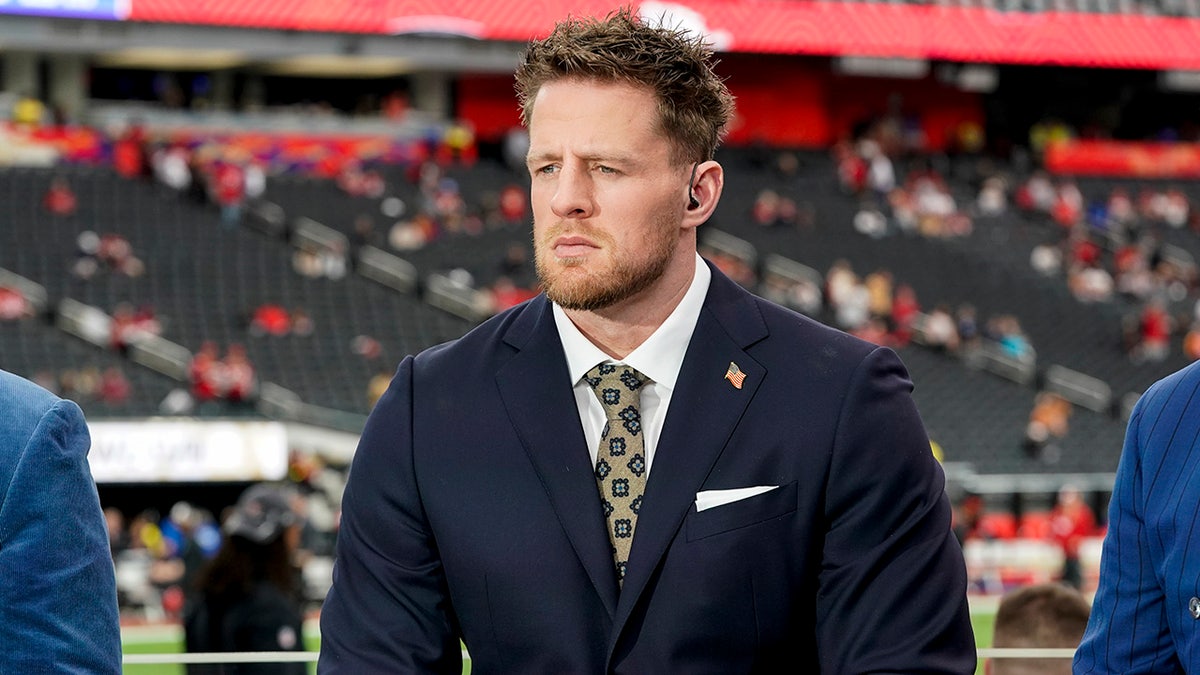 J.J. Watt in suit announcing at at Allegiant Stadium in Las Vegas, Nevada for Super Bowl LVIII in 2024.