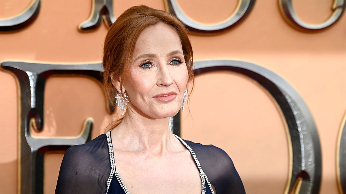 J.K. Rowling arrives on red carpet at film premiere event.