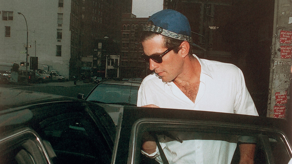 John F. Kennedy Jr. entering a car in New York City.