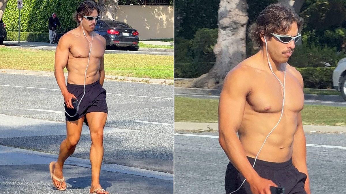 Joseph Baena goes shirtless for a walk in Santa Monica.