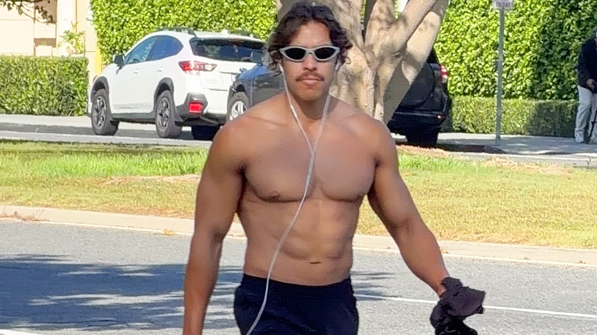 Arnold Schwarzenegger's son Joseph Baena goes for a walk