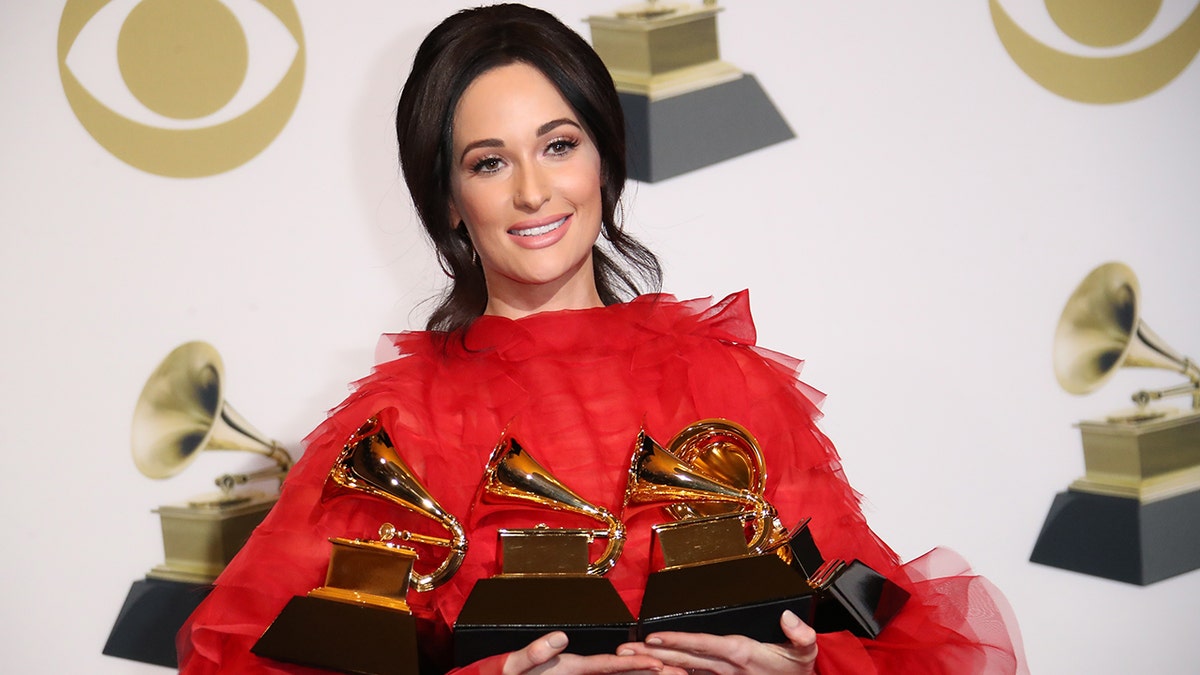 Kacey Musgraves holding her Grammys following the award show in Los Angeles in February 2019.
