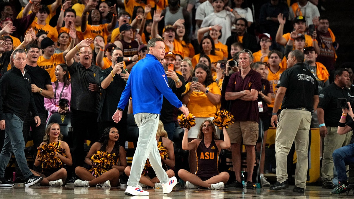 Kansas head coach Bill Self walking off the basketball court after ejection.