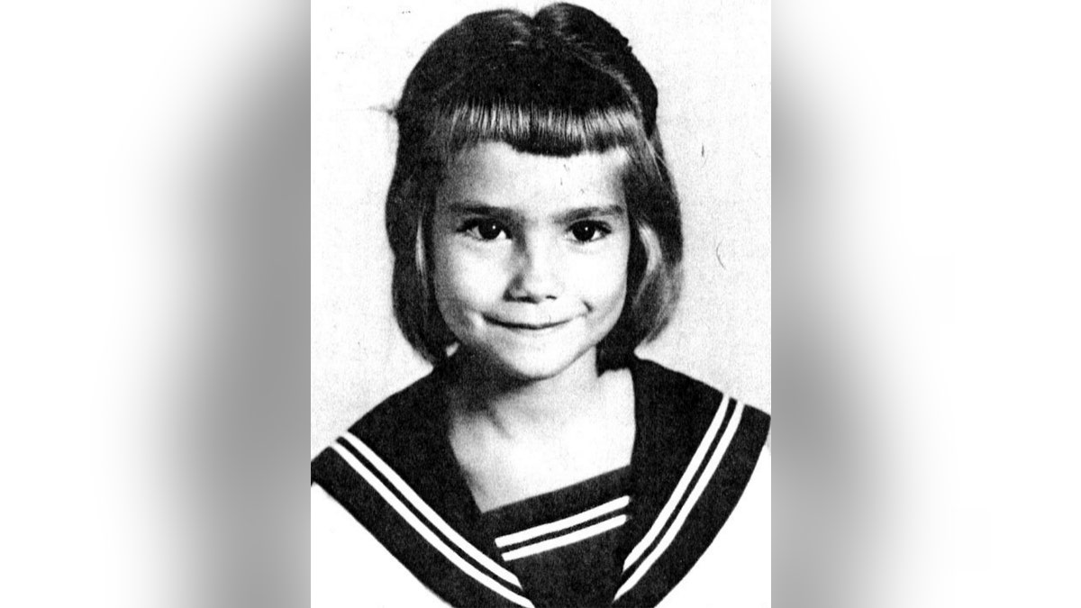 A young Kathie Lee Gifford wearing a sailor dress.