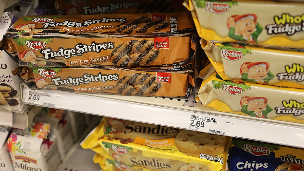 Keebler cookie selection including fudge-striped and Sandies on shelves at grocery store.