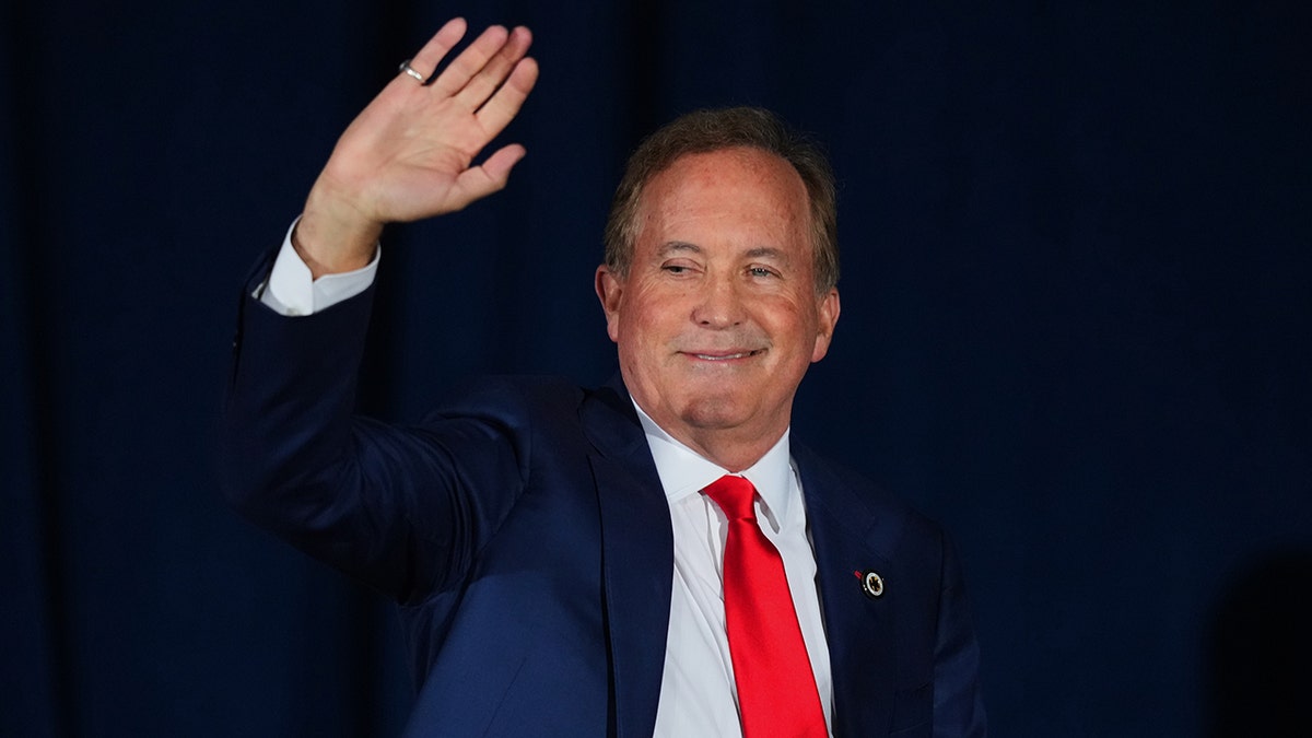 Ken Paxton waving to supporters at an election night primary watch party in Dallas, Texas.