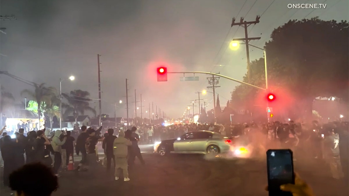 silver attraction   doing donuts successful  intersection during thoroughfare  takeover