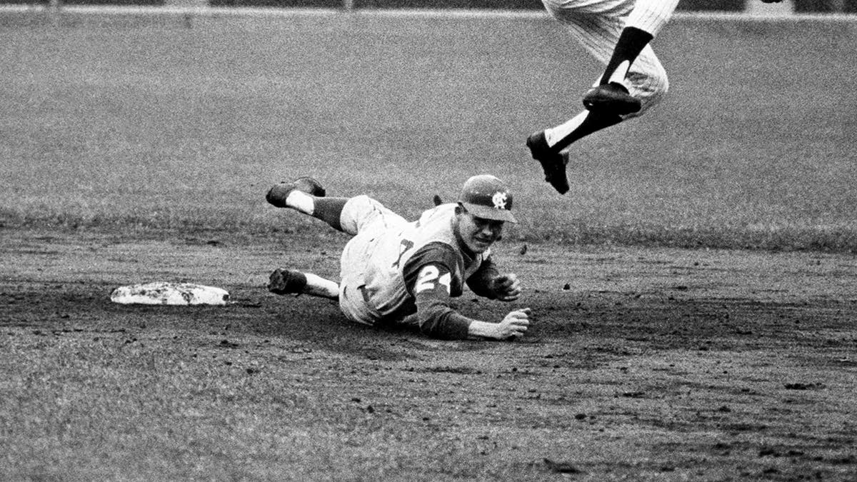 Larry Stahl slides into second base