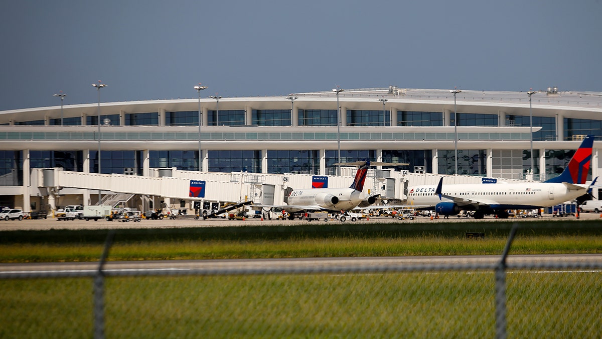 Planes parked in front of Louis Armstrong International Airport.