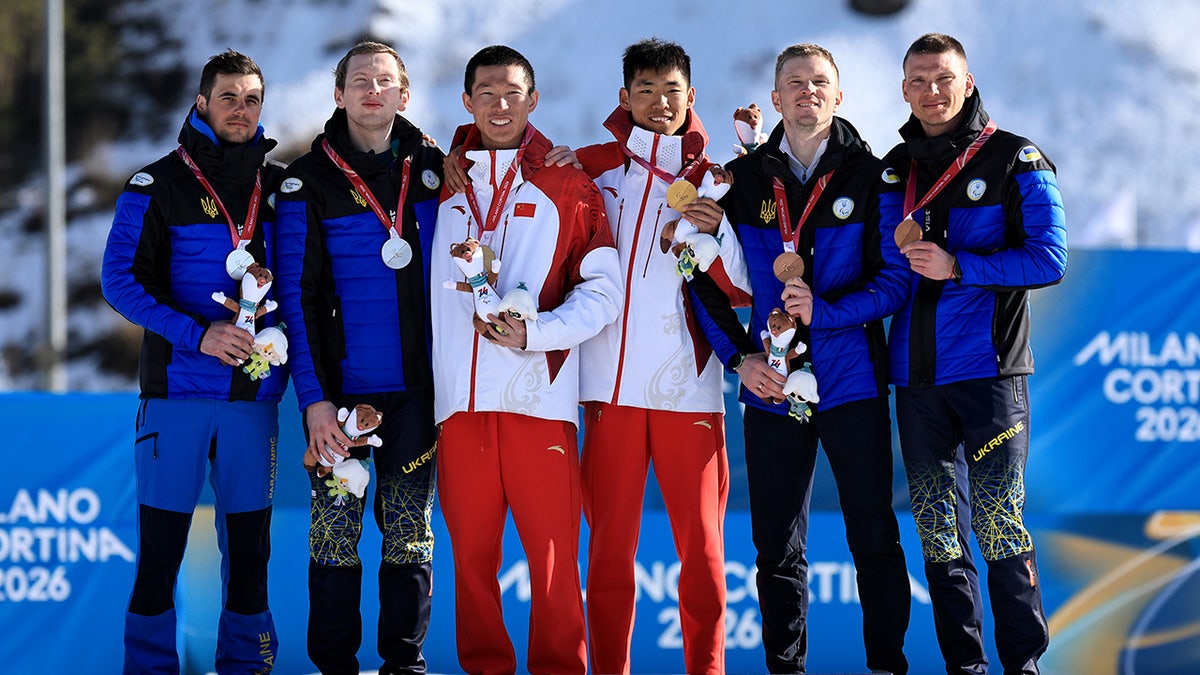 Maksym Murashkovskyi poses on podium