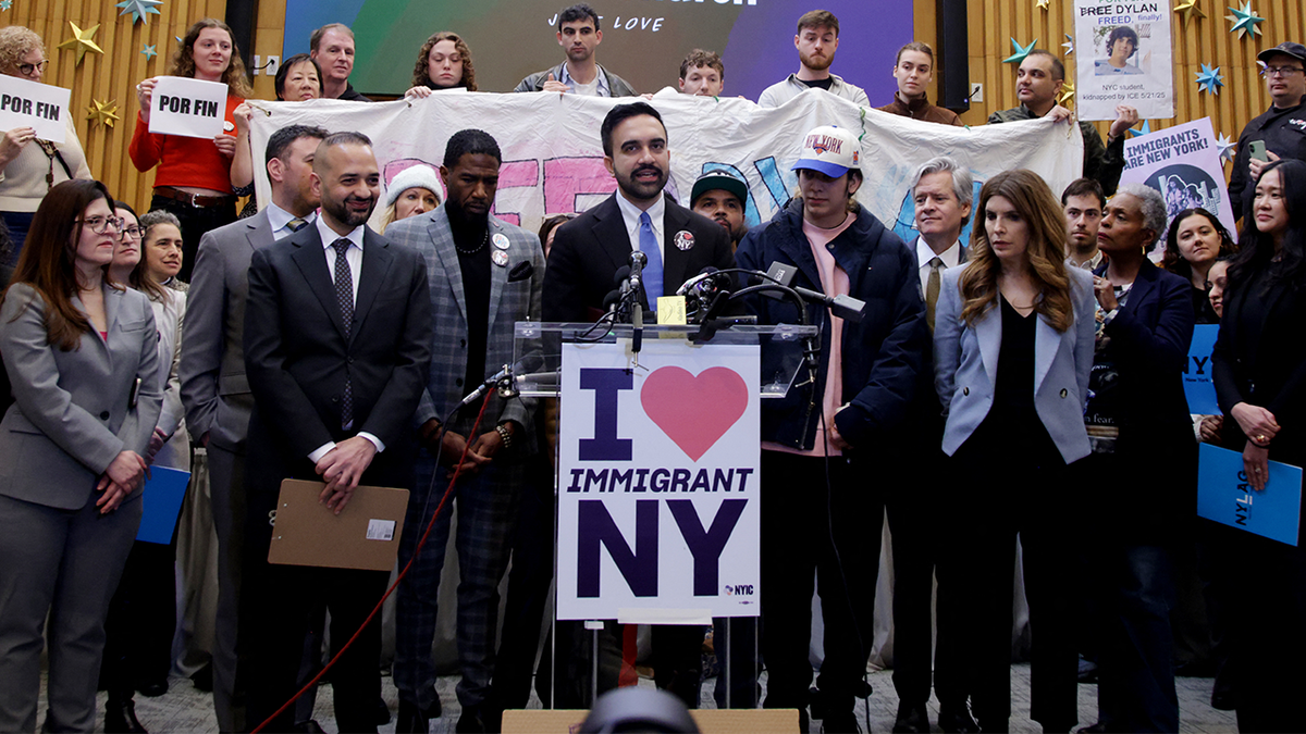 Zohran Mamdani speaking astatine  a podium.