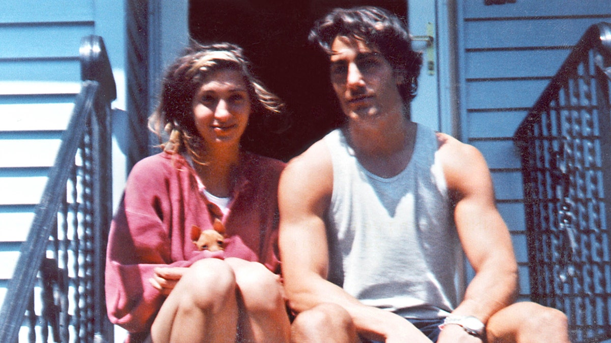 Carolyn Bessette and Michael Bergin sitting on the front steps of his parent's home in Naugatuck, Connecticut.