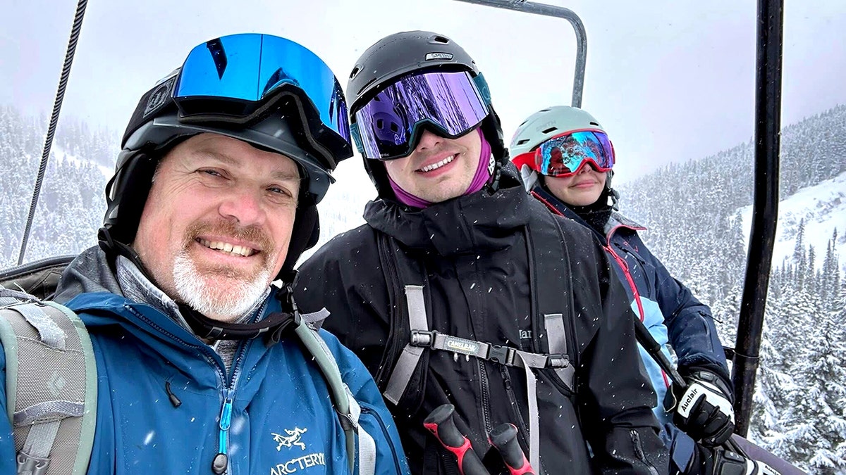 Michael Harris smiling on a ski lift