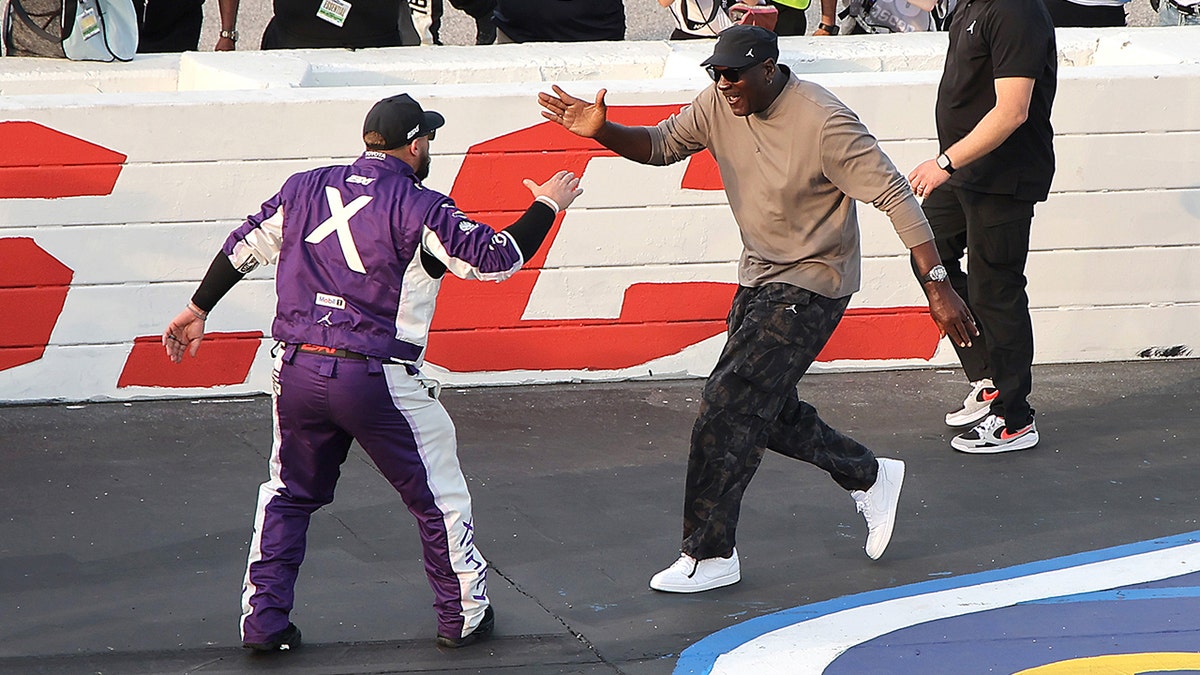 Michael Jordan celebrates with Tyler Reddick
