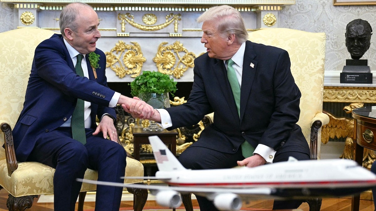Irish Prime Minister Micheal Martin and President Donald Trump shake hands