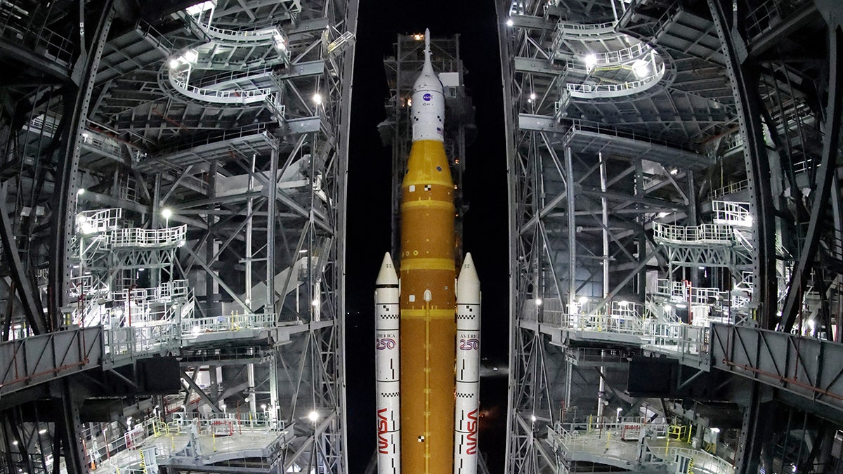 The NASA Artemis II rocket with the Orion spacecraft leaving the Vehicle Assembly Building at the Kennedy Space Center.