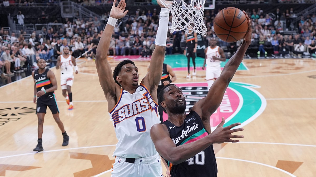 Harrison Barnes goes for a lay up