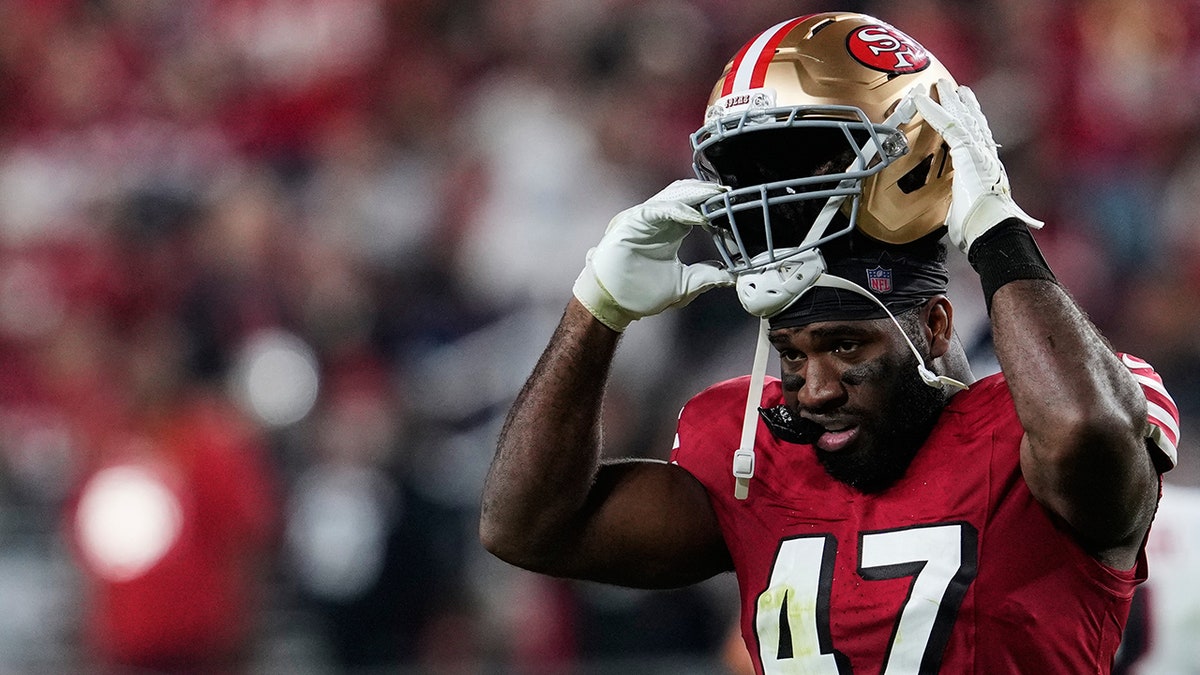 Bryce Huff puts on his helmet