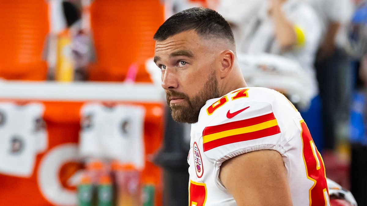 Travis Kelce sits on the bench