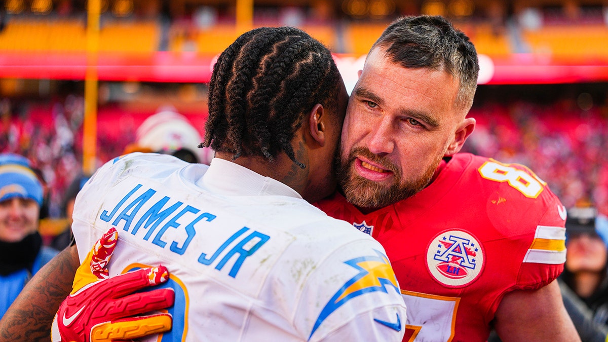 Travis Kelce hugs Derwin James Jr