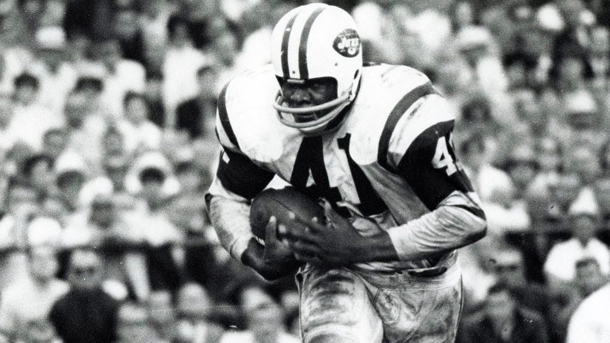 Matt Snell runs with the football