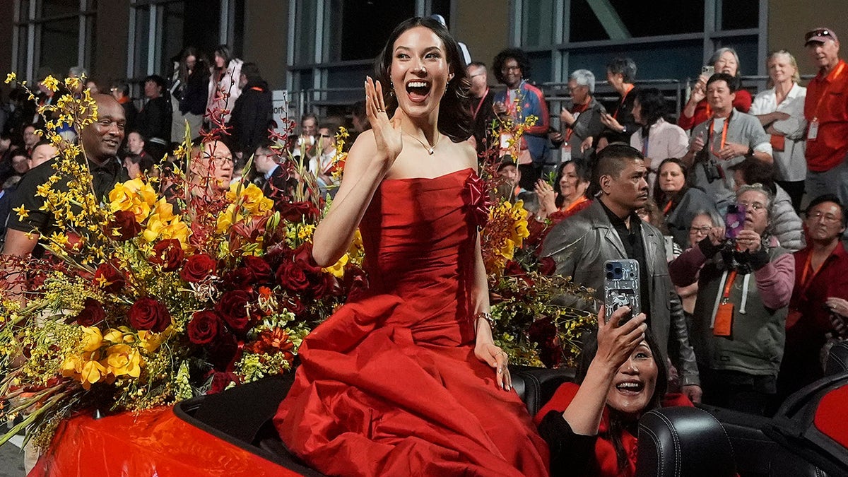 Eileen Gu waves to the crowd