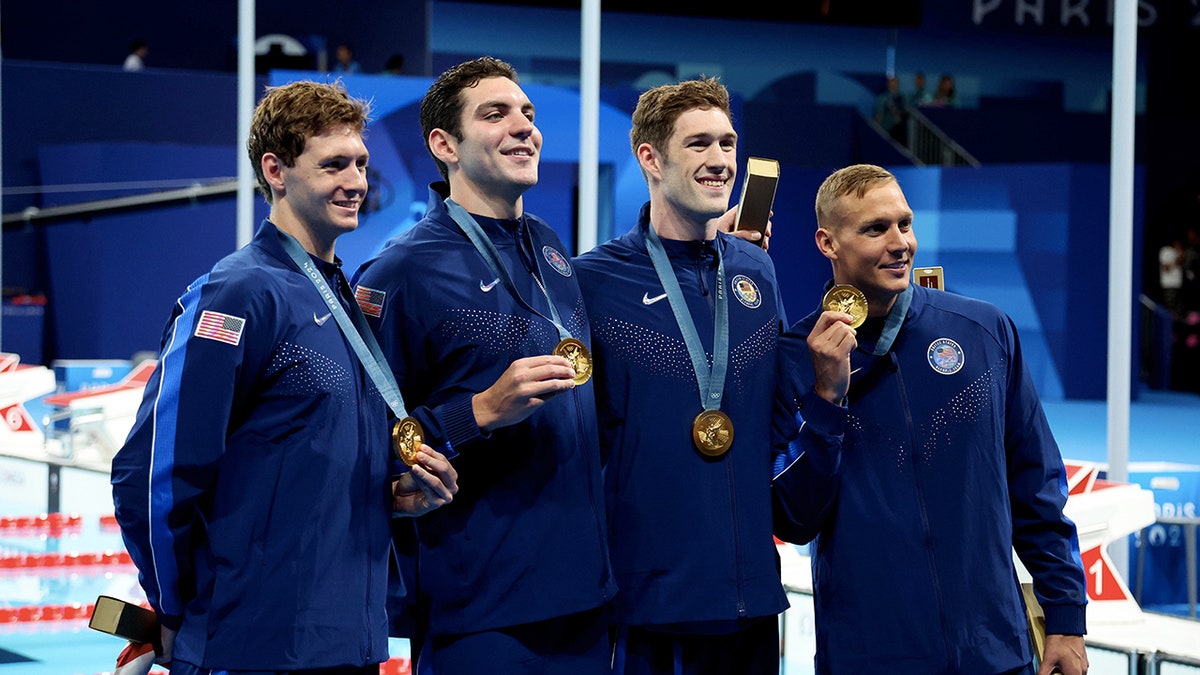 Hunter Armstrong celebrates gold medal