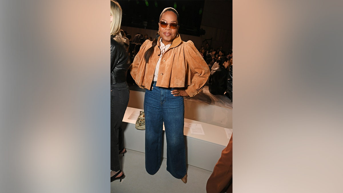 Oprah Winfrey wearing jeans at the Chloe fashion show during Paris Fashion Week in March 2026.