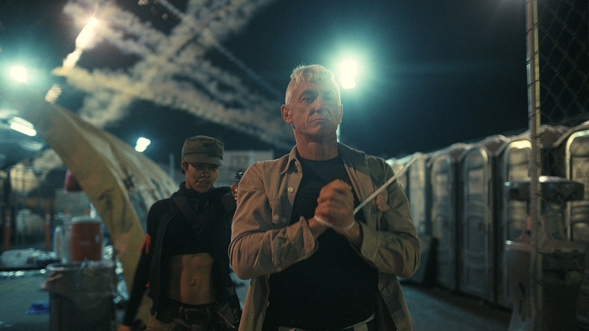 Teyana Taylor and Sean Penn appearing in a scene from the film One Battle After Another.