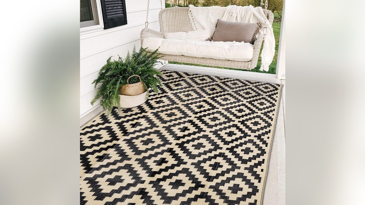 Add a rug to quickly define spaces in your backyard.