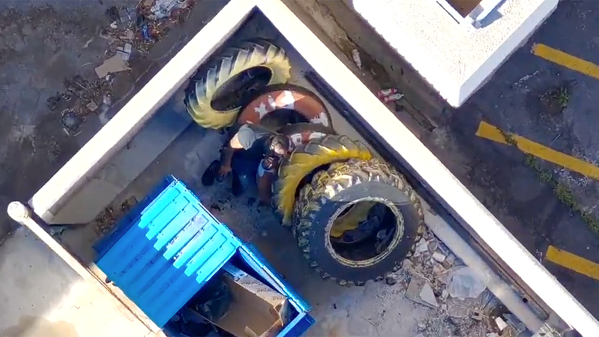 Police drone captures suspect hiding near tires and dumpster behind Las Vegas business after alleged rampage