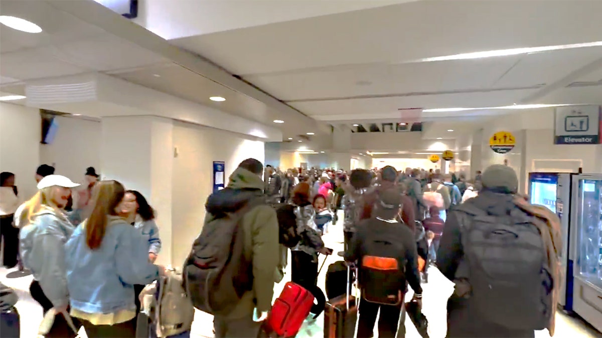 Travelers stand in long TSA line in Philly