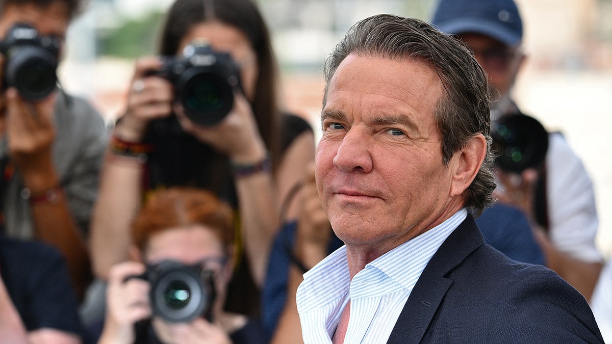 Photographers taking Dennis Quaid's picture