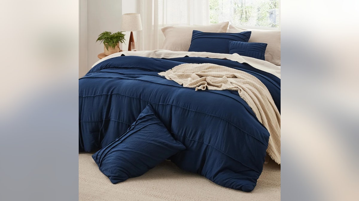 Shop this soft pinch pleat comforter for a lighter feel.
