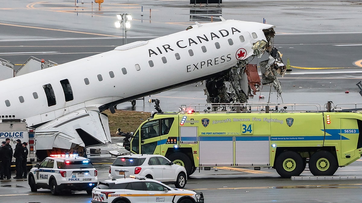 An Air Canada Express CRJ-900 airplane sitting connected  a runway astatine  LaGuardia Airport aft  a collision.