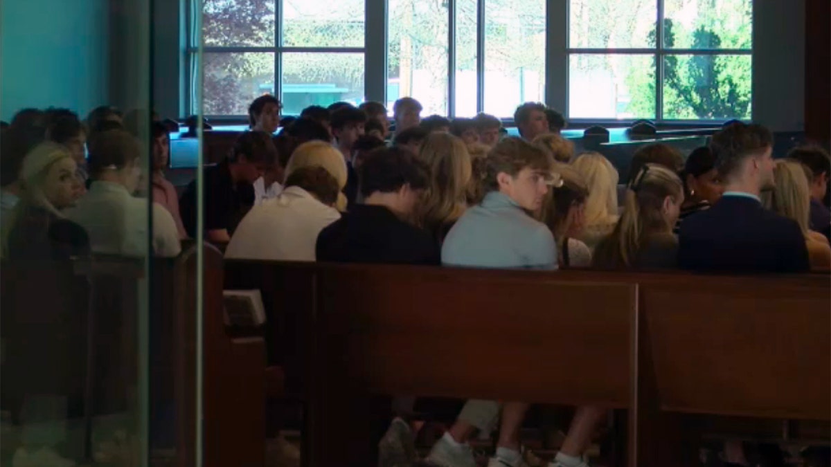 People gather for a memorial service