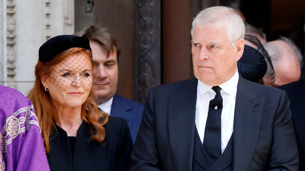 Sarah Ferguson with then-Prince Andrew in mourning clothes in 2022