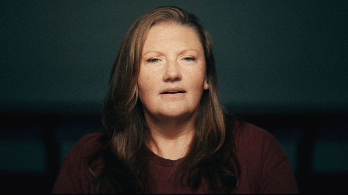 A close-up of Sarah Jo Pender wearing a burgundy sweater.