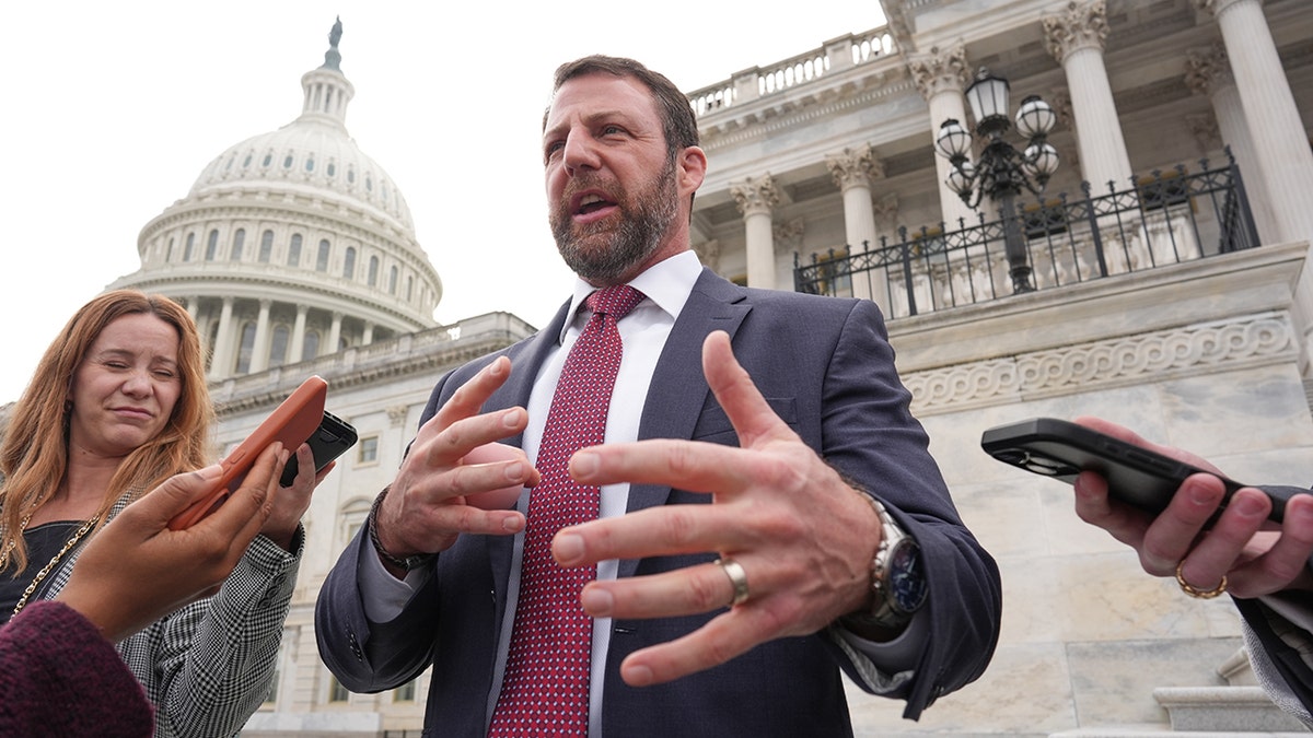 Senator Markwayne Mullin speaks to reporters at the Capitol.