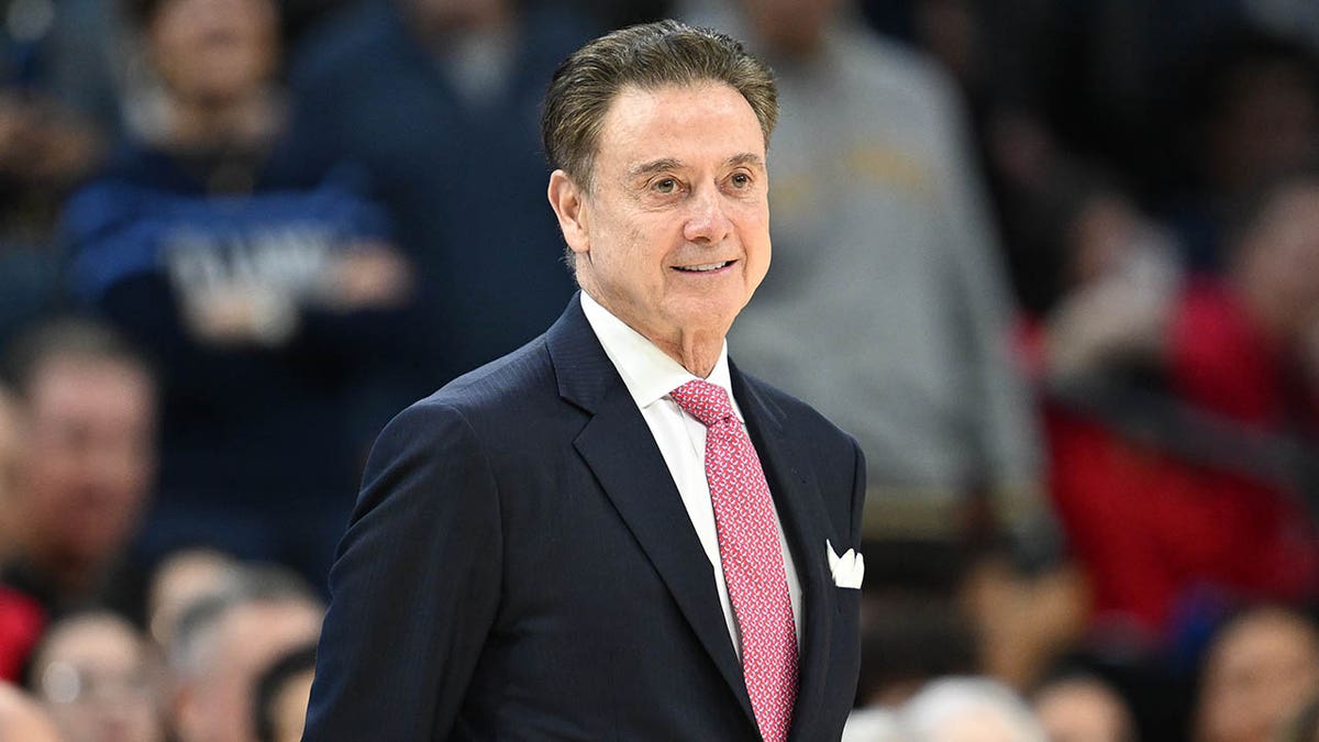 Rick Pitino looks on