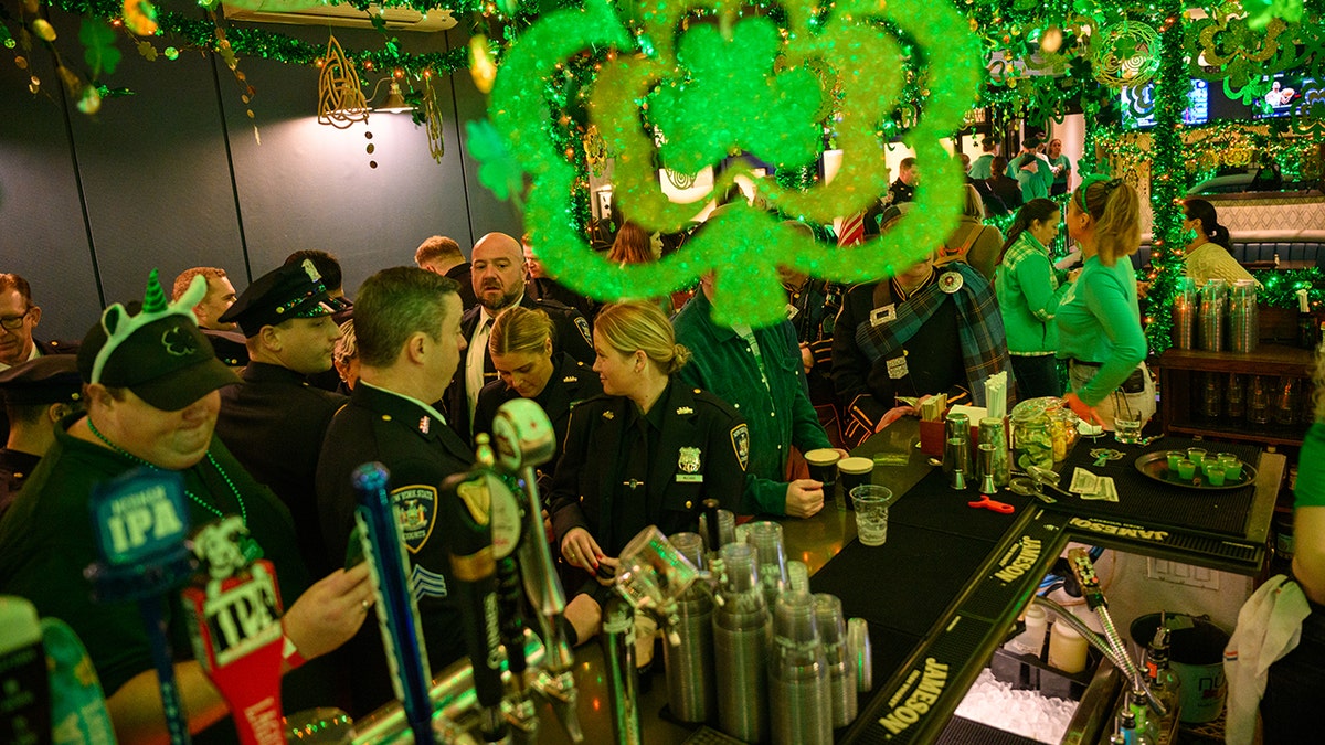 Parade participants gather in a Irish pub ahead of the St. Patrick's Day Parade as they march along Fifth Avenue on March 17, 2025 in New York City.