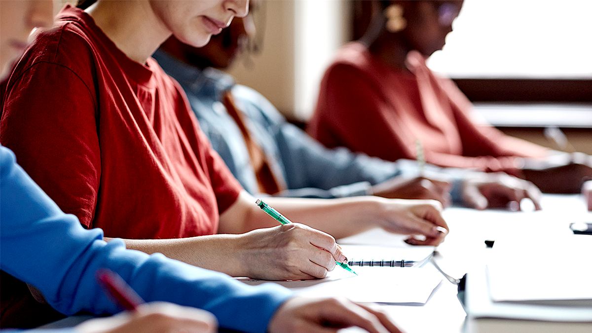 College students taking test in classroom