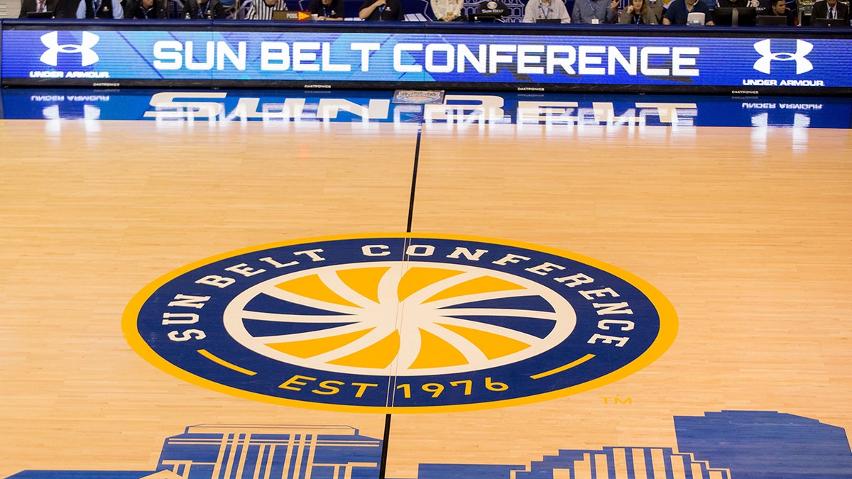 The Sun Belt Conference logo at mid court