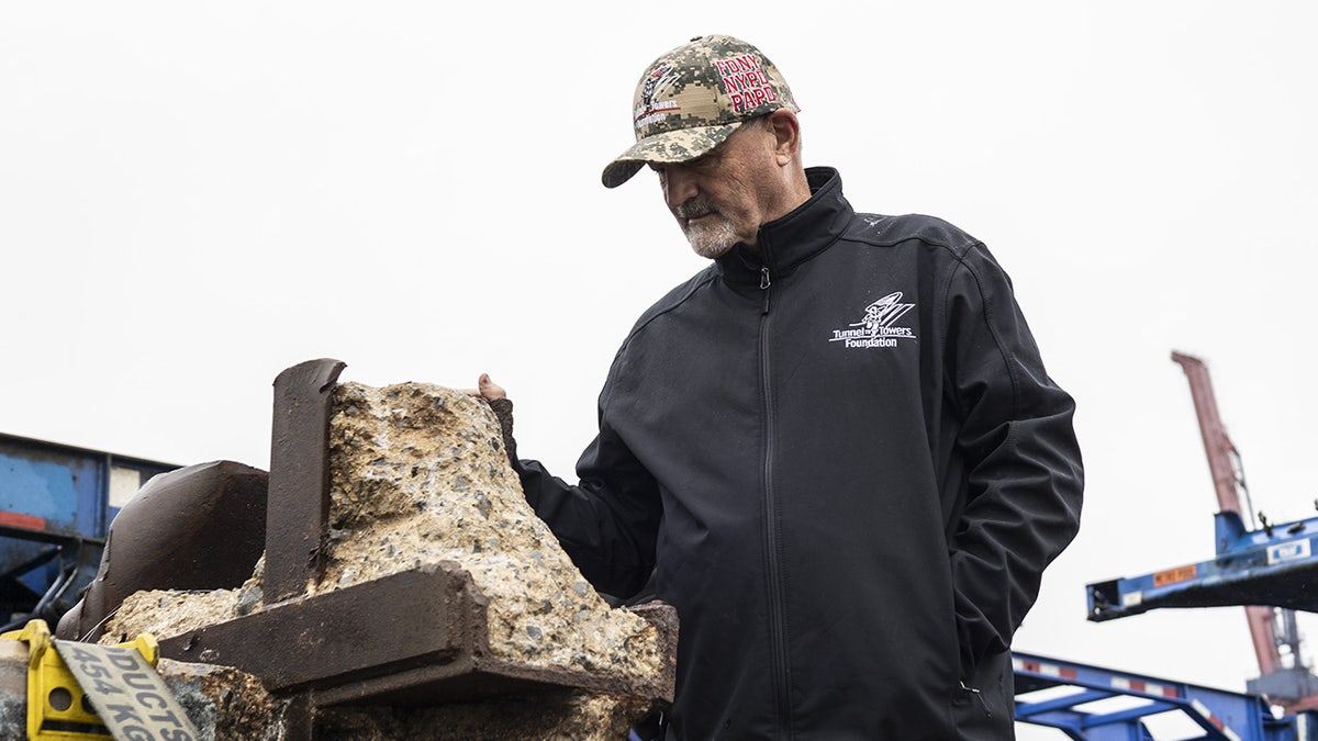 Tunnel to Towers CEO Frank Siller stands near a piece of World Trade Center steel