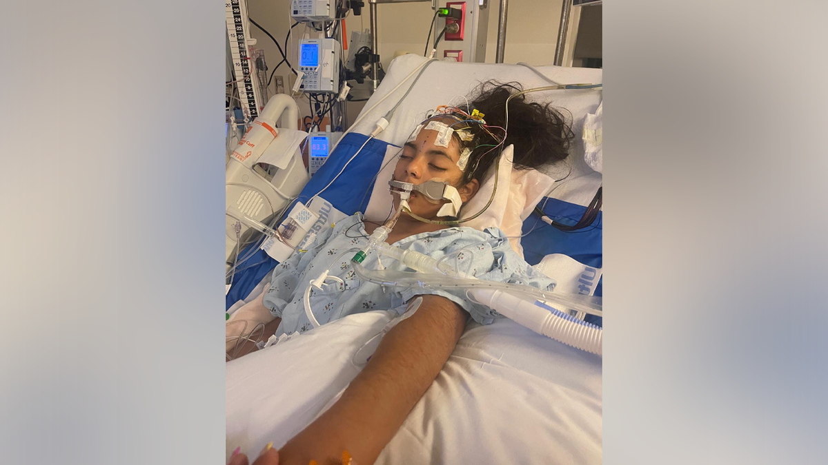 Khimberly Zavaleta in a hospital bed after suffering a severe head injury