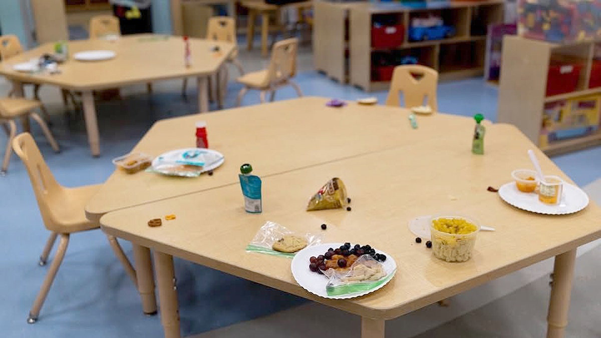 Children's lunch on a small table in the childcare center