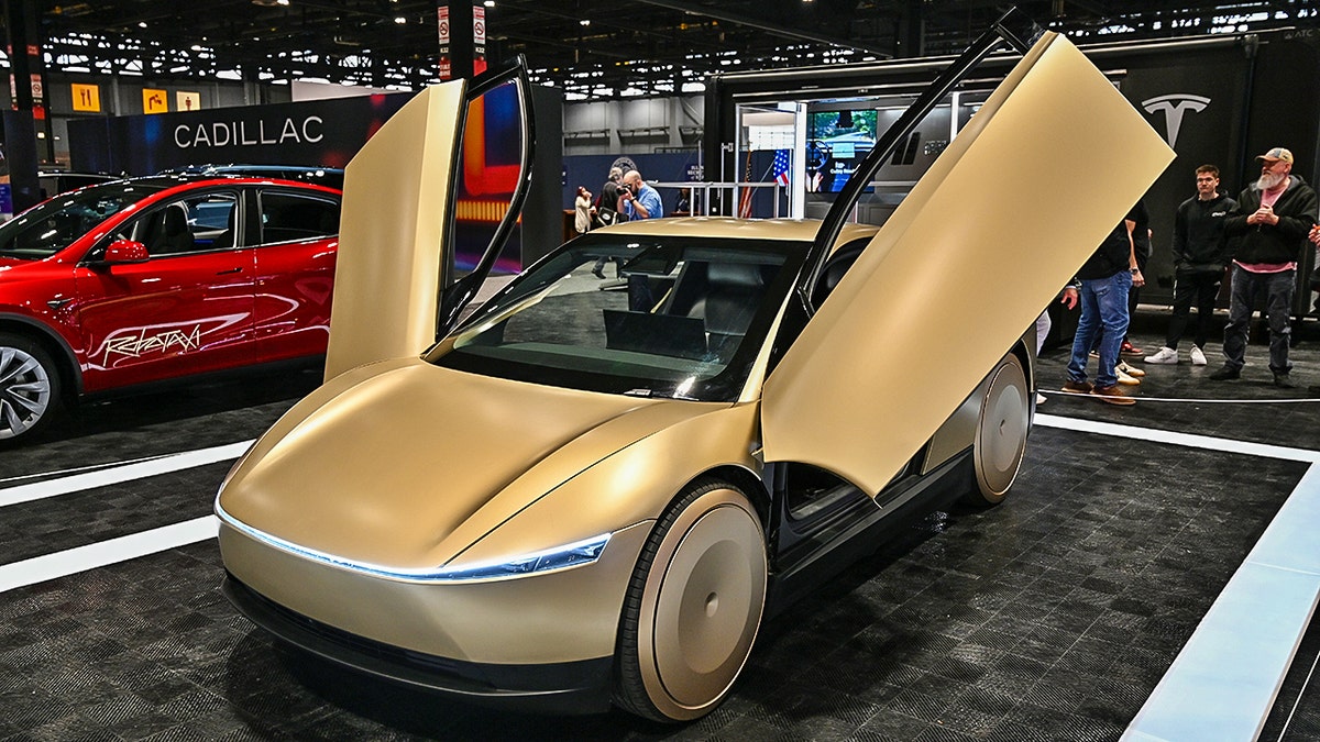 Front view of the CyberCab with the doors open.