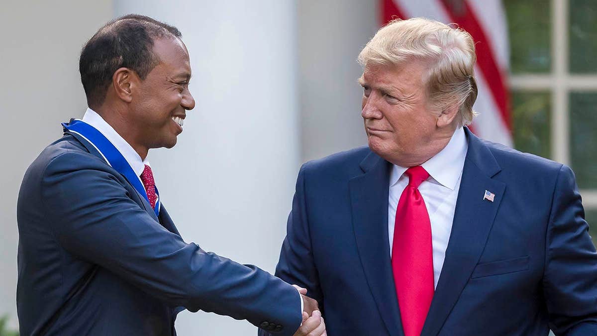 U.S. President Donald Trump presenting the Presidential Medal of Freedom to Tiger Woods in the White House Rose Garden
