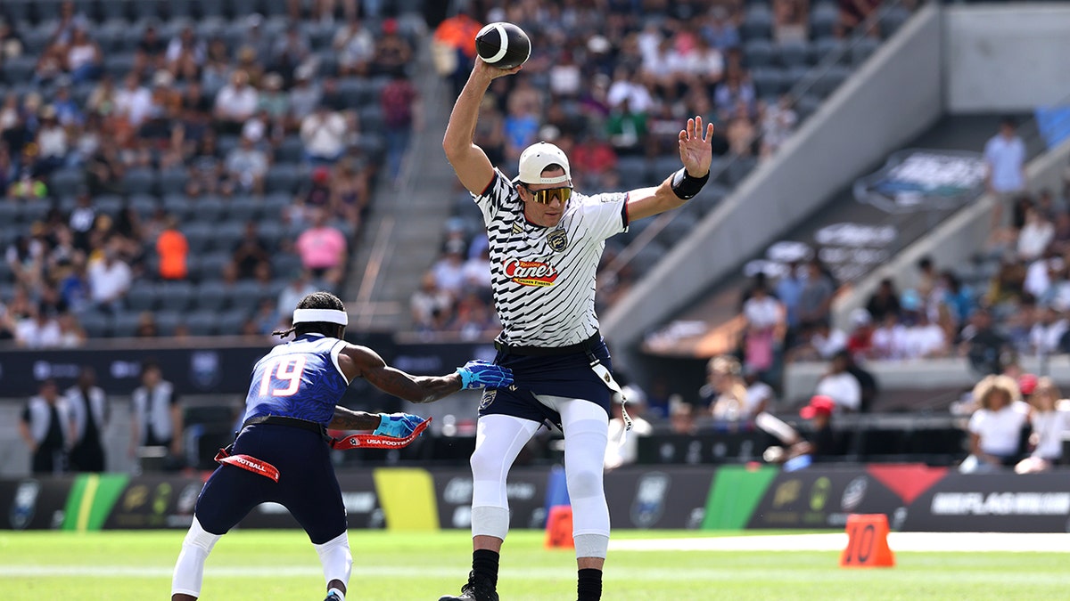 Tom Brady dodges defender